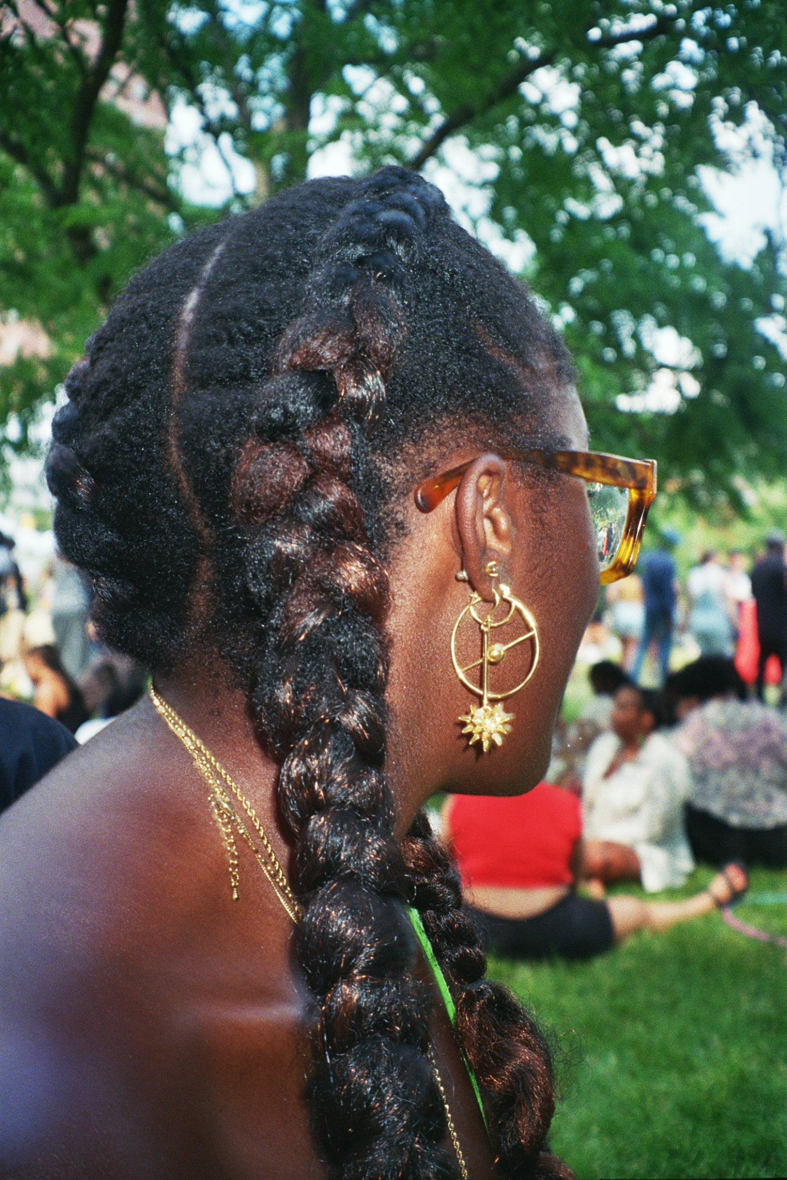 Front view, On Body: Gold vermeil hoop earring with line going through circle design.